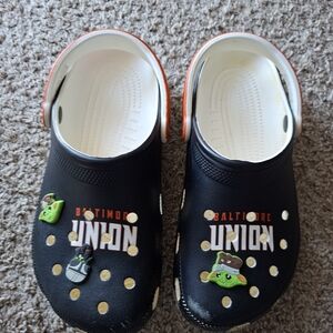 CROCS Black and White Baltimore Union Slip-On Clogs with Orange Trim